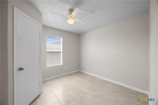 4104 Matt Ct, Killeen, TX 76549 - spare room featuring a ceiling fan, a textured ceiling, baseboards, and light tile patterned flooring