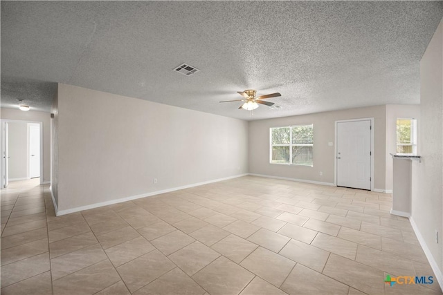 4104 Matt Ct, Killeen, TX 76549 - spare room with ceiling fan, a textured ceiling, light tile patterned flooring, and baseboards