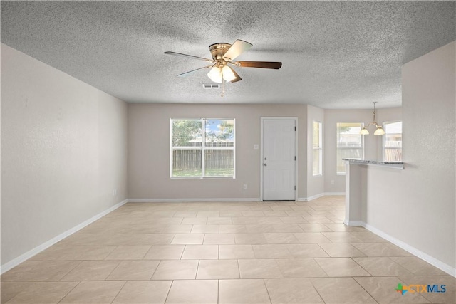 4104 Matt Ct, Killeen, TX 76549 - spare room with ceiling fan, a chandelier, a textured ceiling, and baseboards