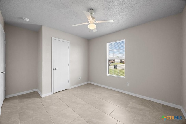 4104 Matt Ct, Killeen, TX 76549 - unfurnished bedroom with a textured ceiling, light tile patterned flooring, ceiling fan, and baseboards