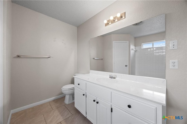 4104 Matt Ct, Killeen, TX 76549 - bathroom with a textured ceiling, vanity, toilet, a shower, and tile patterned floors