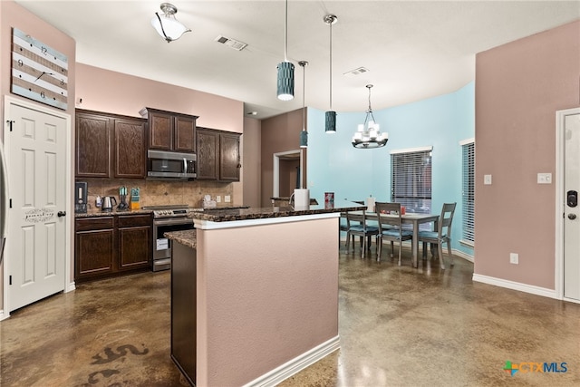 kitchen featuring decorative light fixtures, tasteful backsplash, a center island, dark brown cabinetry, and stainless steel appliances