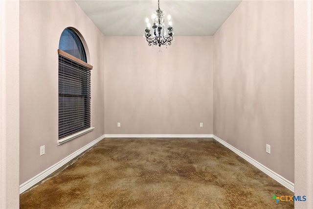 empty room with a notable chandelier