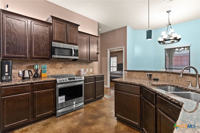 kitchen with dark brown cabinetry, sink, pendant lighting, stainless steel appliances, and backsplash