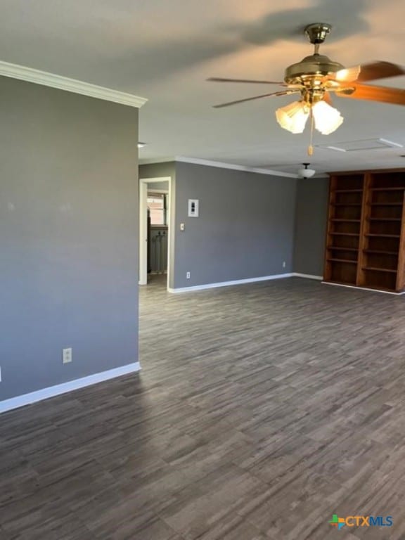 unfurnished room with dark wood-style floors, baseboards, a ceiling fan, and ornamental molding