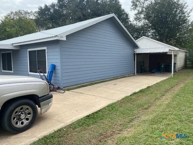 view of side of property with an outbuilding