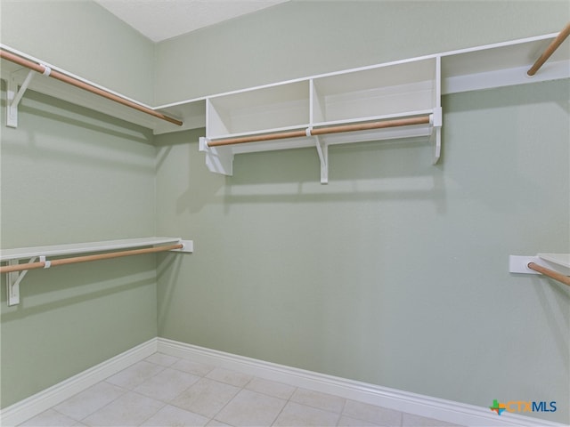 walk in closet featuring light tile patterned floors