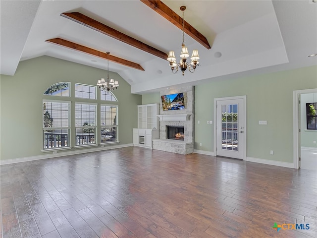 unfurnished living room featuring vaulted ceiling with beams and dark hardwood / wood-style floors