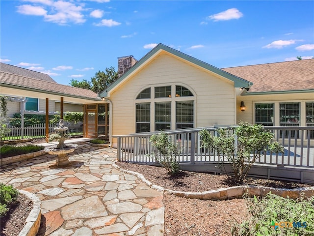 back of property featuring a patio area