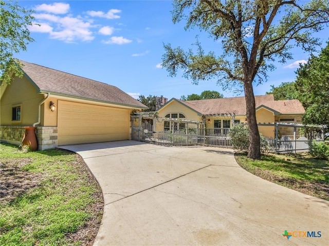 ranch-style house featuring a garage