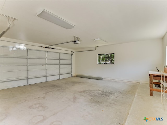 garage featuring a garage door opener