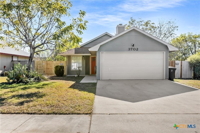 single story home featuring a front yard and a garage