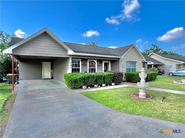 ranch-style house with a front lawn, concrete driveway, stone siding, a carport, and roof with shingles