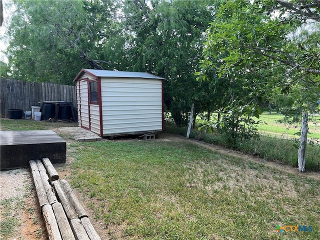view of yard with a storage unit and an outdoor structure