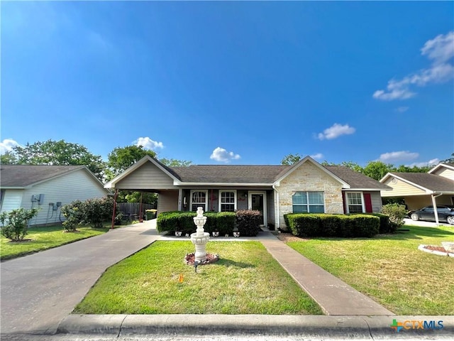 single story home with a front lawn, a carport, stone siding, and concrete driveway