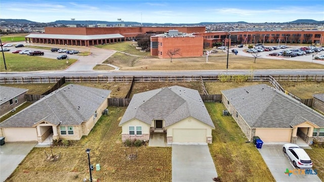 birds eye view of property with a mountain view