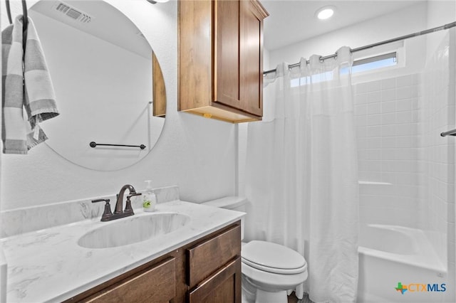 full bathroom featuring toilet, vanity, and shower / tub combo with curtain