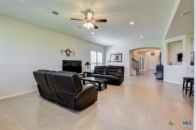 tiled living room featuring ceiling fan