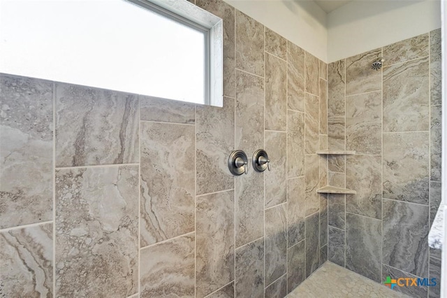 bathroom featuring tiled shower