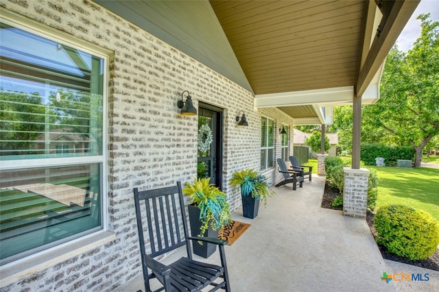 view of patio featuring a porch