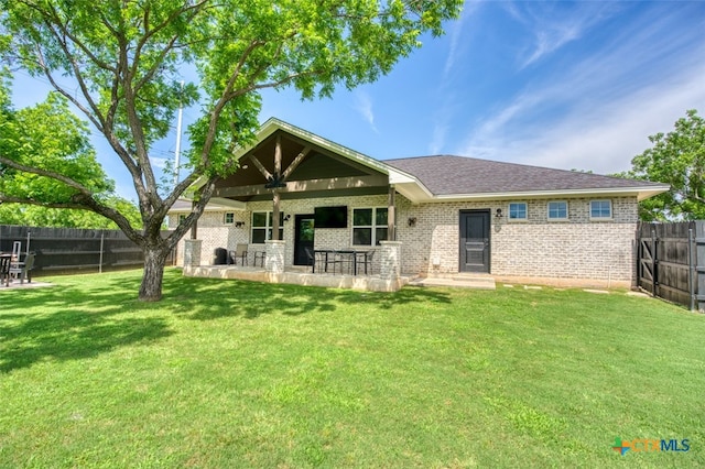 back of house with a patio, a yard, and ceiling fan