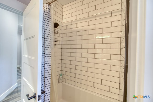 bathroom with shower / bath combination with curtain