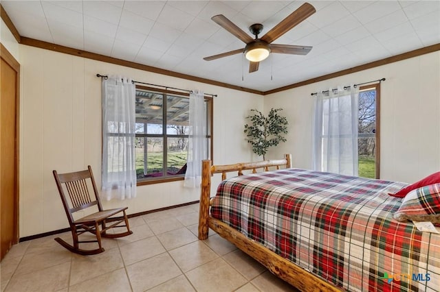 1068 Ranch Road 165, Blanco, TX 78606 - bedroom with light tile patterned floors, crown molding, and ceiling fan