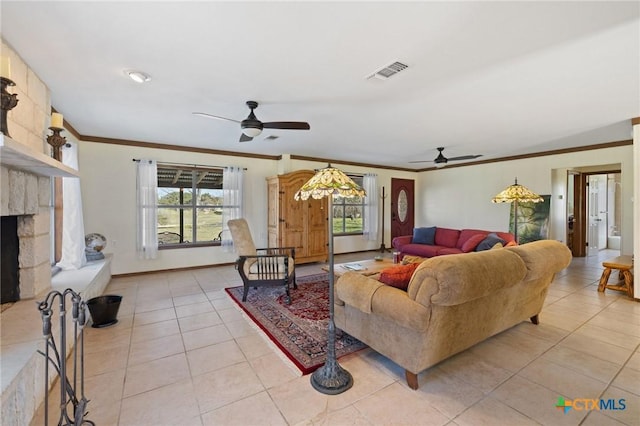 1068 Ranch Road 165, Blanco, TX 78606 - living area with ceiling fan, light tile patterned floors, ornamental molding, and a fireplace