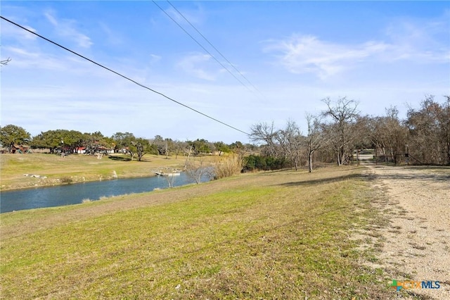 1068 Ranch Road 165, Blanco, TX 78606 - view of green lawn featuring a water view