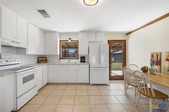 1068 Ranch Road 165, Blanco, TX 78606 - kitchen with white appliances, under cabinet range hood, a sink, light countertops, and white cabinets