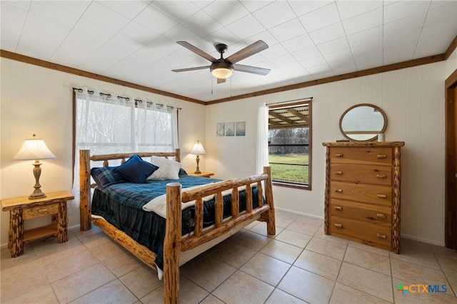 1068 Ranch Road 165, Blanco, TX 78606 - bedroom featuring crown molding, light tile patterned floors, baseboards, and ceiling fan