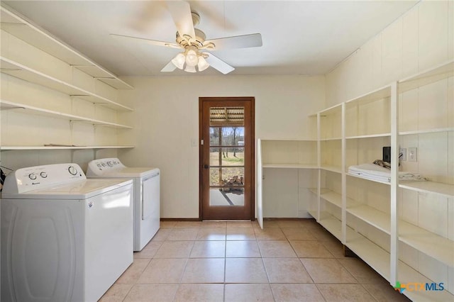 1068 Ranch Road 165, Blanco, TX 78606 - laundry area with separate washer and dryer, light tile patterned flooring, ceiling fan, and baseboards