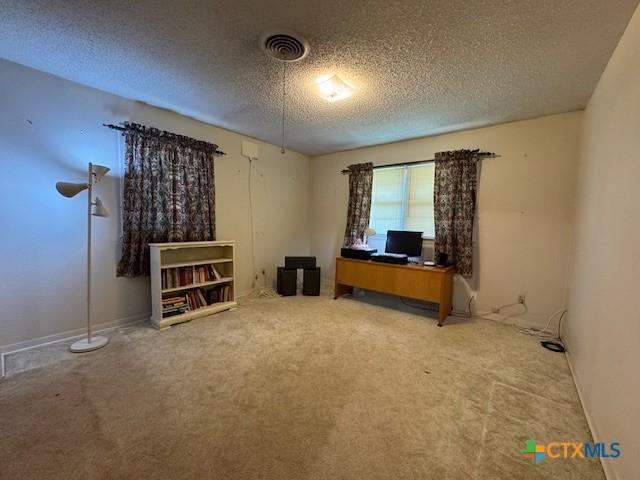 2410 Robin Rd, Temple, TX 76502 - office space featuring a textured ceiling and carpet flooring