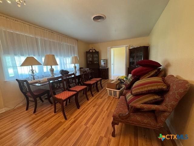 2410 Robin Rd, Temple, TX 76502 - dining room featuring wood finished floors and healthy amount of natural light