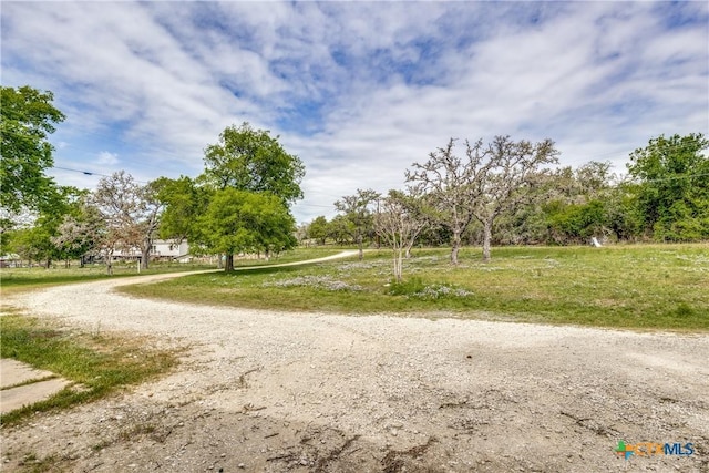 view of property's community featuring driveway