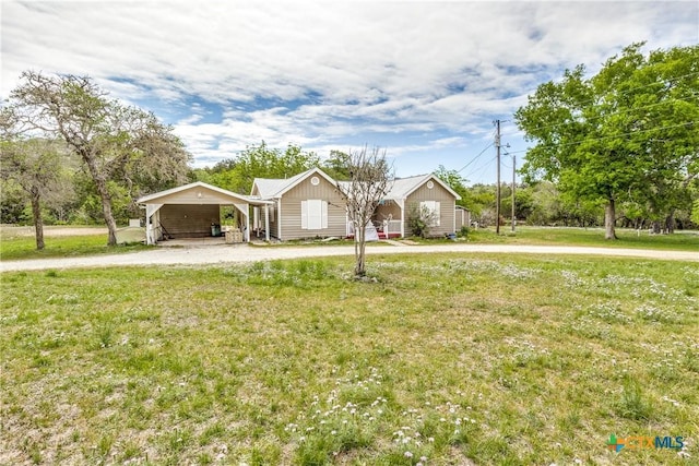 ranch-style house with driveway and a front yard