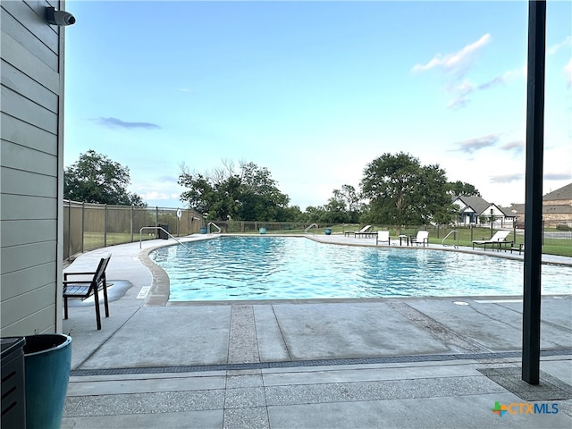 view of swimming pool with a patio area