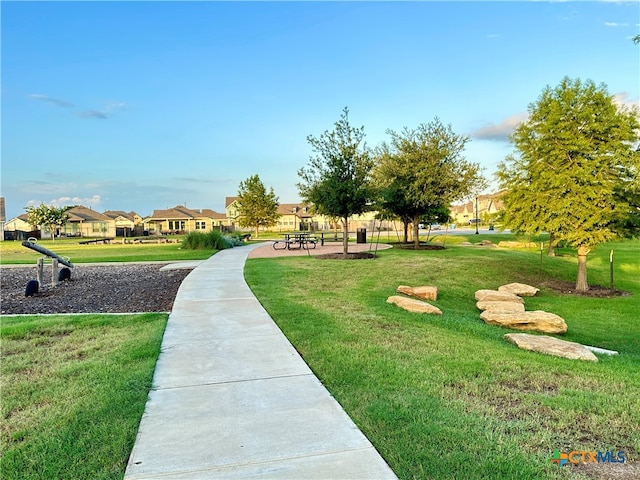 view of community featuring a yard