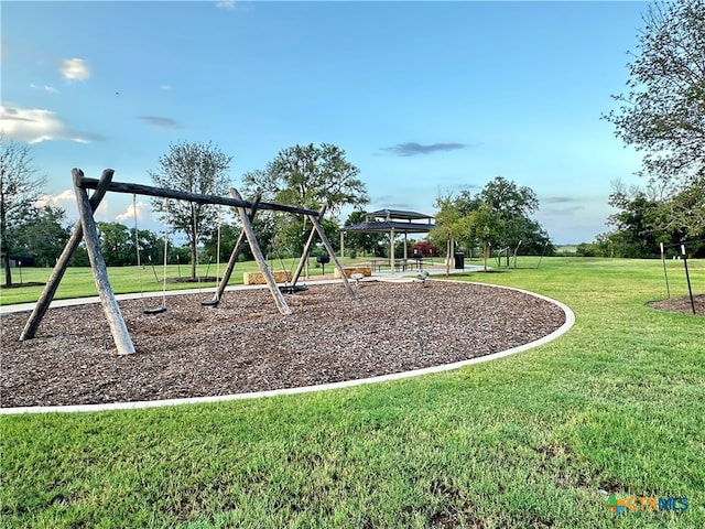 view of jungle gym featuring a gazebo and a lawn