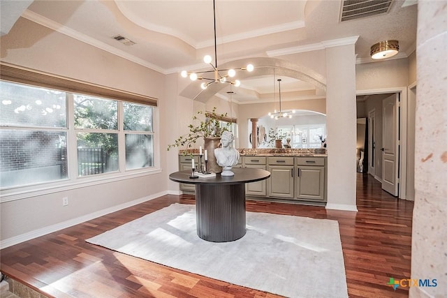 2788 Morning Moon, New Braunfels, TX 78132 - dining space featuring a chandelier, crown molding, dark wood-style flooring, and healthy amount of natural light