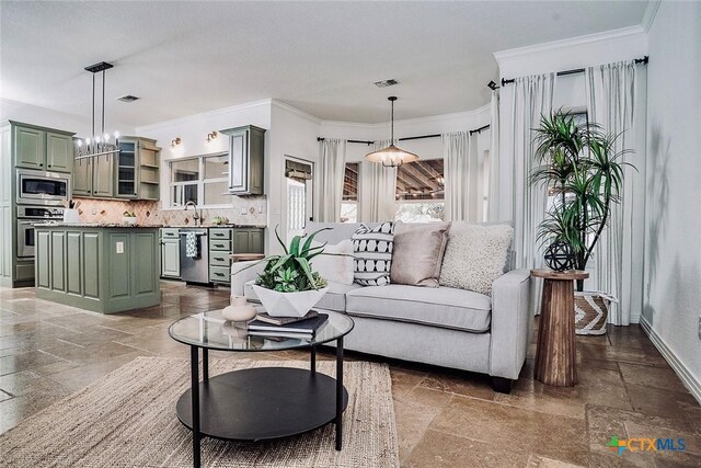 2788 Morning Moon, New Braunfels, TX 78132 - living area with stone tile floors, ornamental molding, and baseboards