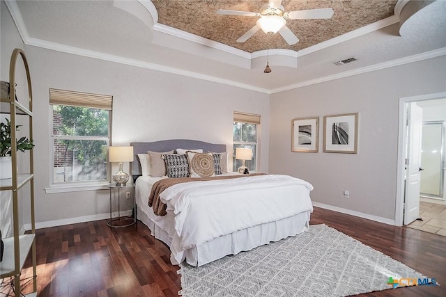 2788 Morning Moon, New Braunfels, TX 78132 - bedroom featuring a tray ceiling, wood finished floors, baseboards, ensuite bath, and a ceiling fan