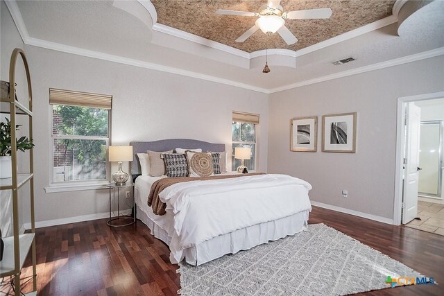 2788 Morning Moon, New Braunfels, TX 78132 - bedroom with a raised ceiling, wood finished floors, baseboards, ensuite bath, and crown molding