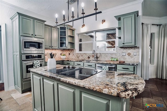 2788 Morning Moon, New Braunfels, TX 78132 - kitchen featuring appliances with stainless steel finishes, stone tile flooring, decorative backsplash, a sink, and light stone counters