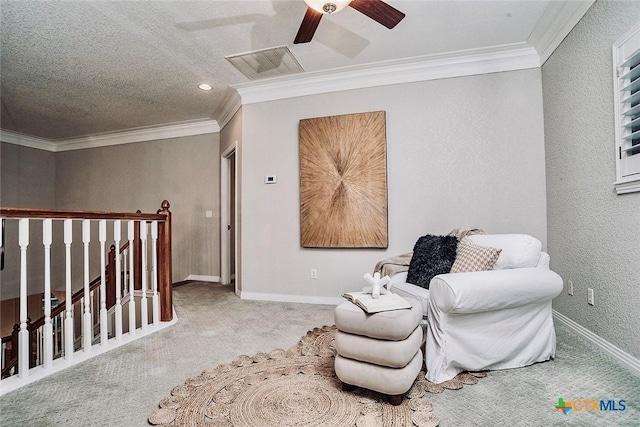 2788 Morning Moon, New Braunfels, TX 78132 - living area featuring carpet flooring, a ceiling fan, crown molding, baseboards, and an upstairs landing