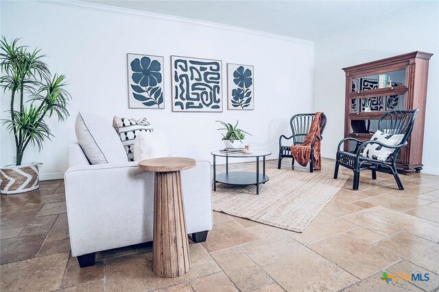 2788 Morning Moon, New Braunfels, TX 78132 - sitting room with stone tile floors, crown molding, and baseboards