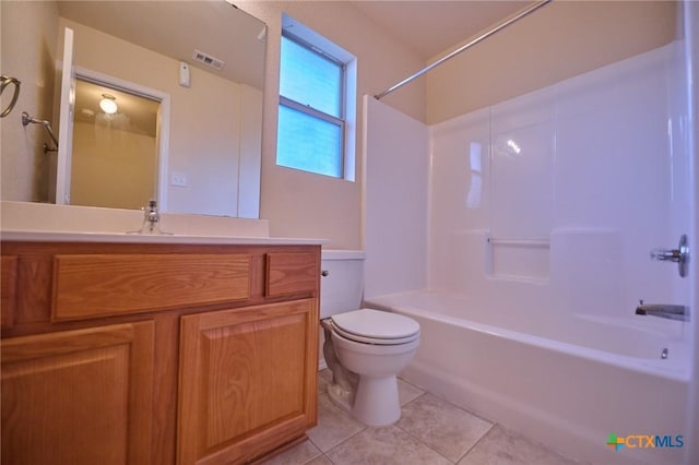 full bathroom with toilet, vanity, tile patterned floors, and washtub / shower combination