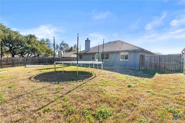 view of yard featuring a trampoline