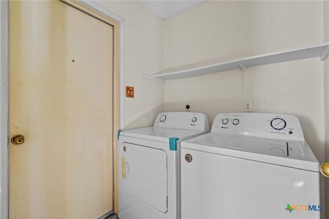 laundry room featuring washing machine and dryer