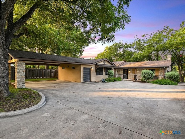 ranch-style house with a carport